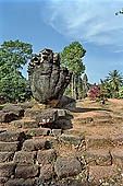 Bakong temple - the enormous naga head of the causeway.